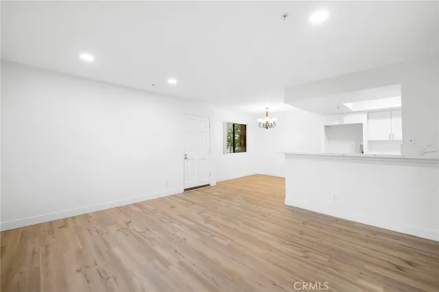 a view of wooden floor and windows in a room