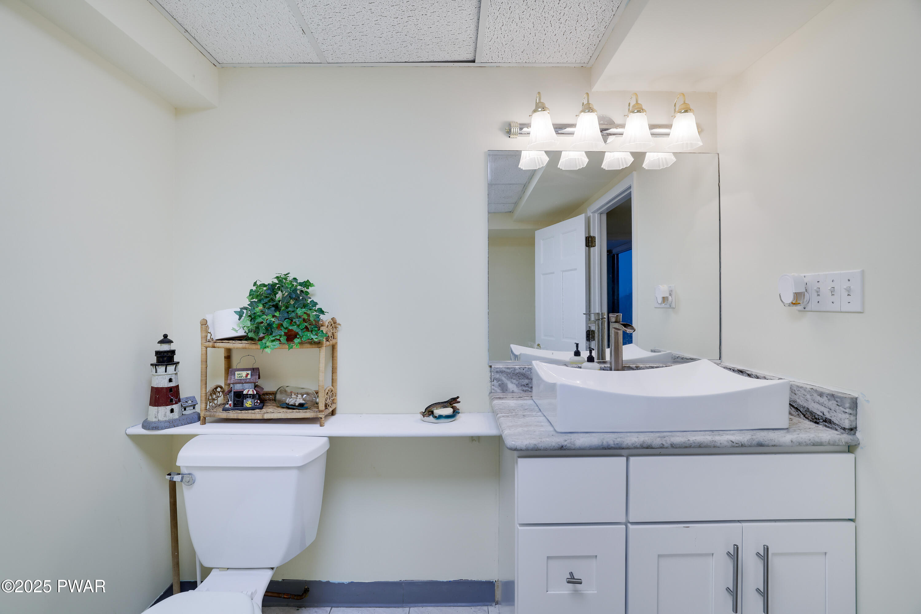 555 Valley View Road Dallas, PA 18612 - Photo 63 of 99 a bathroom with a sink and a mirror