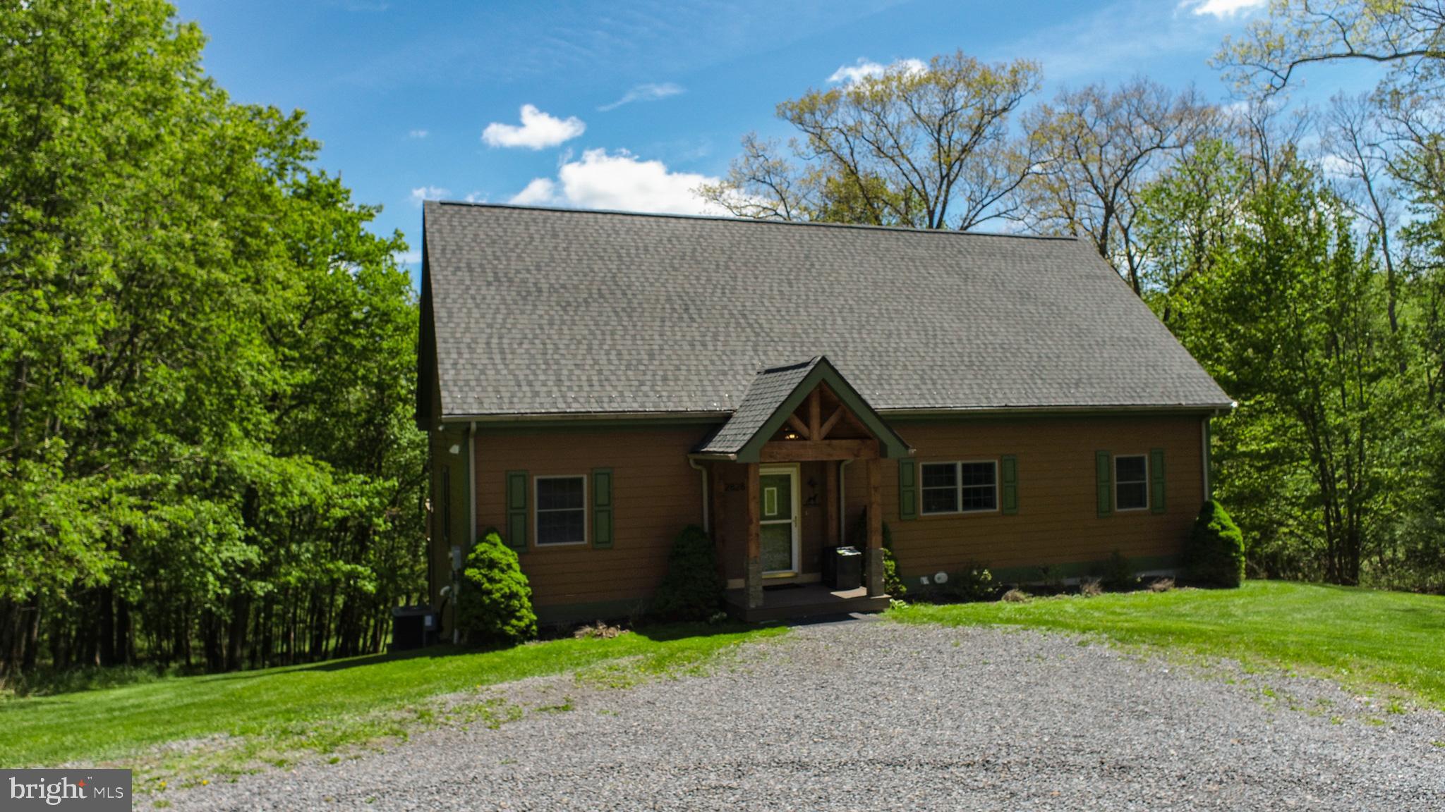 2828 Glendale Road Swanton, MD 21561 - Photo 76 of 78 a front view of a house with a yard and tree