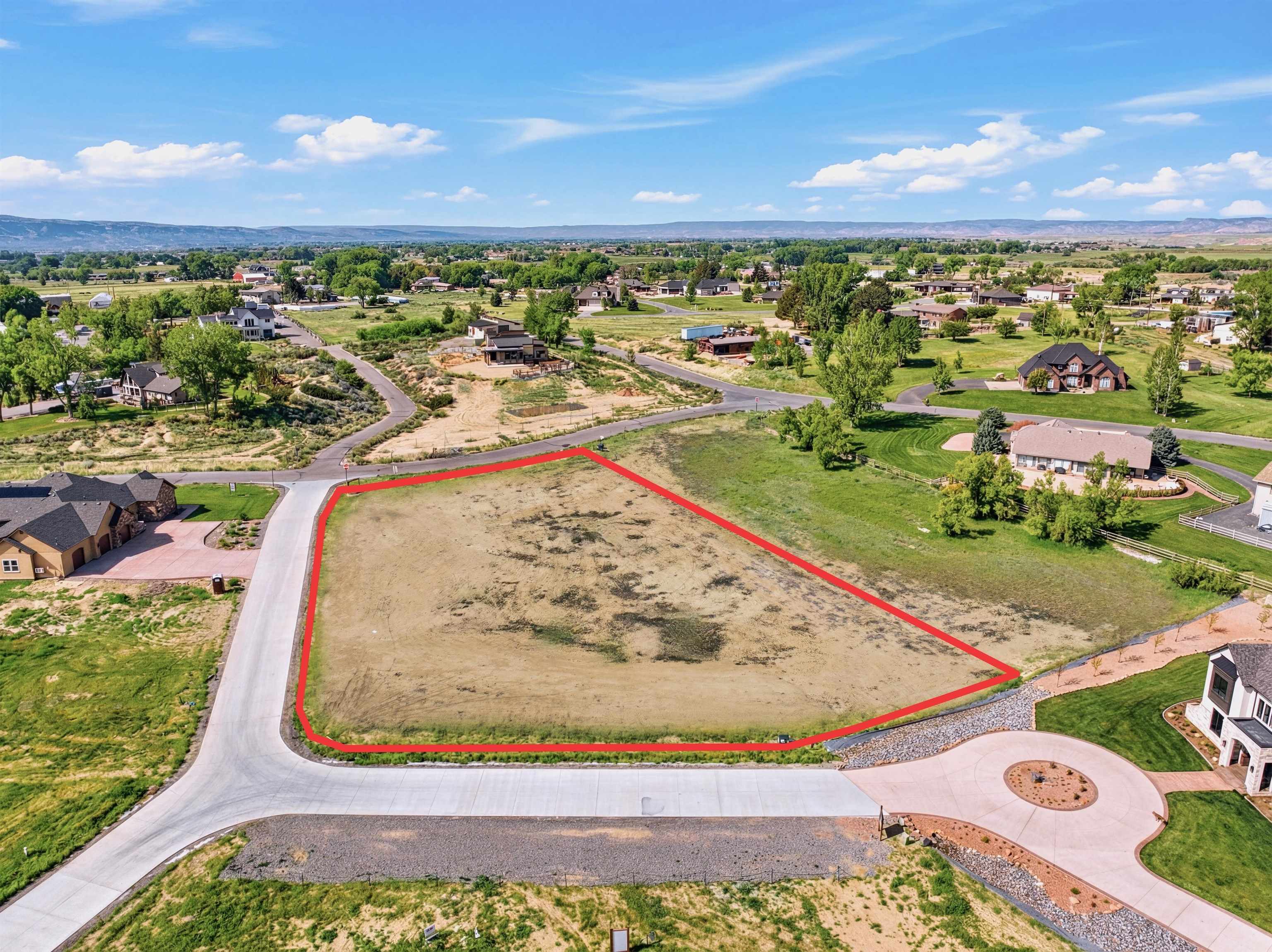 920 25 3/4 Road Grand Junction, CO 81505 - Photo 2 of 8 a view of a swimming pool with a yard and outdoor seating