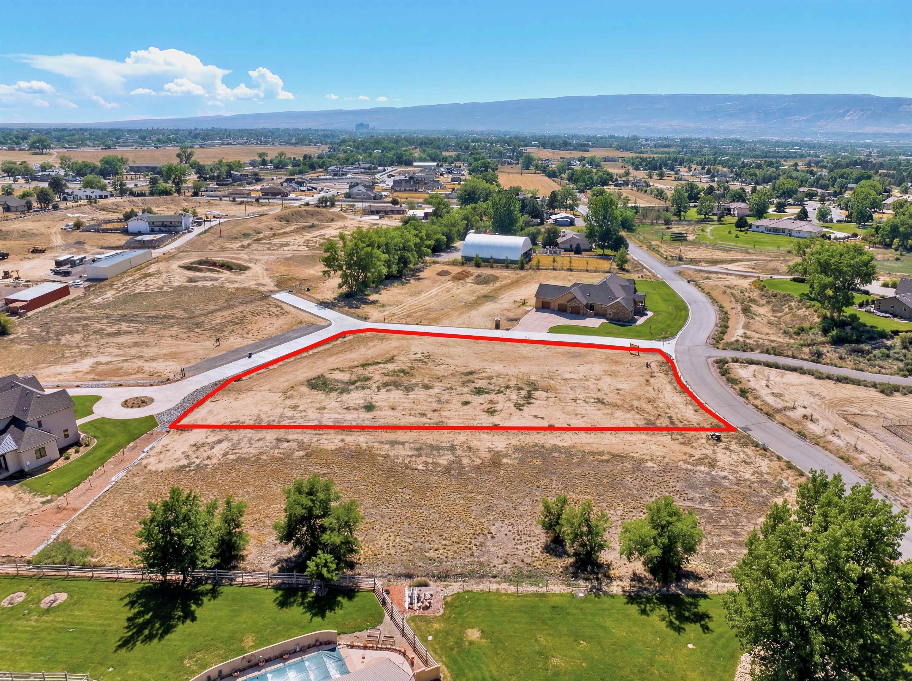 920 25 3/4 Road Grand Junction, CO 81505 - Photo 8 of 8 an aerial view of a house with a garden and lake view