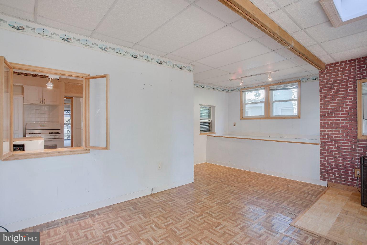 4709 Pilgrim Road Baltimore, MD 21214 - Photo 11 of 44 Family room flows from kitchen to deck