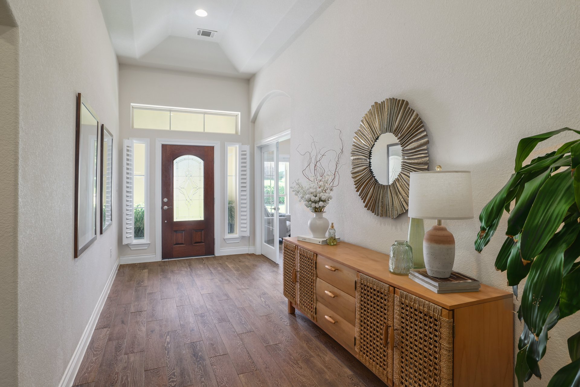 173 Santa Maria Street Georgetown, TX 78628 - Photo 10 of 39 Welcoming foyer featuring wood-finish flooring, a wood front door with decorative glass, sidelights, and a transom window