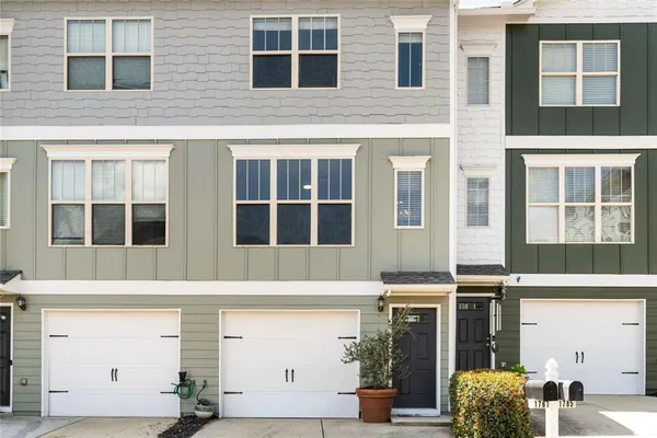a view of a brick building with many windows