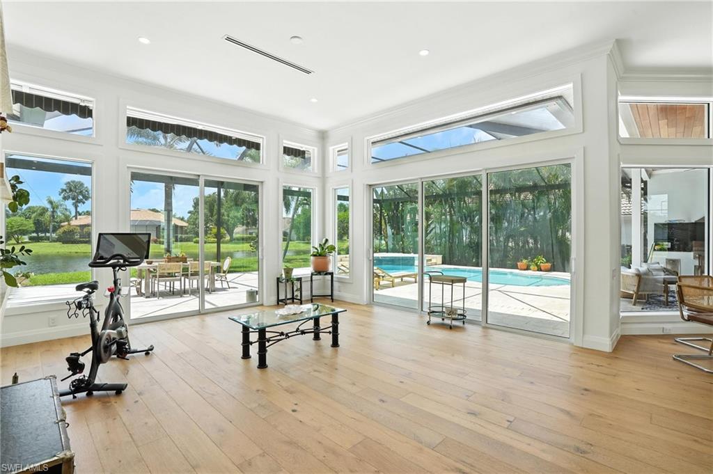 581 Wedgewood Way Naples, FL 34119 - Photo 12 of 33 a view of a livingroom with furniture and floor to ceiling window