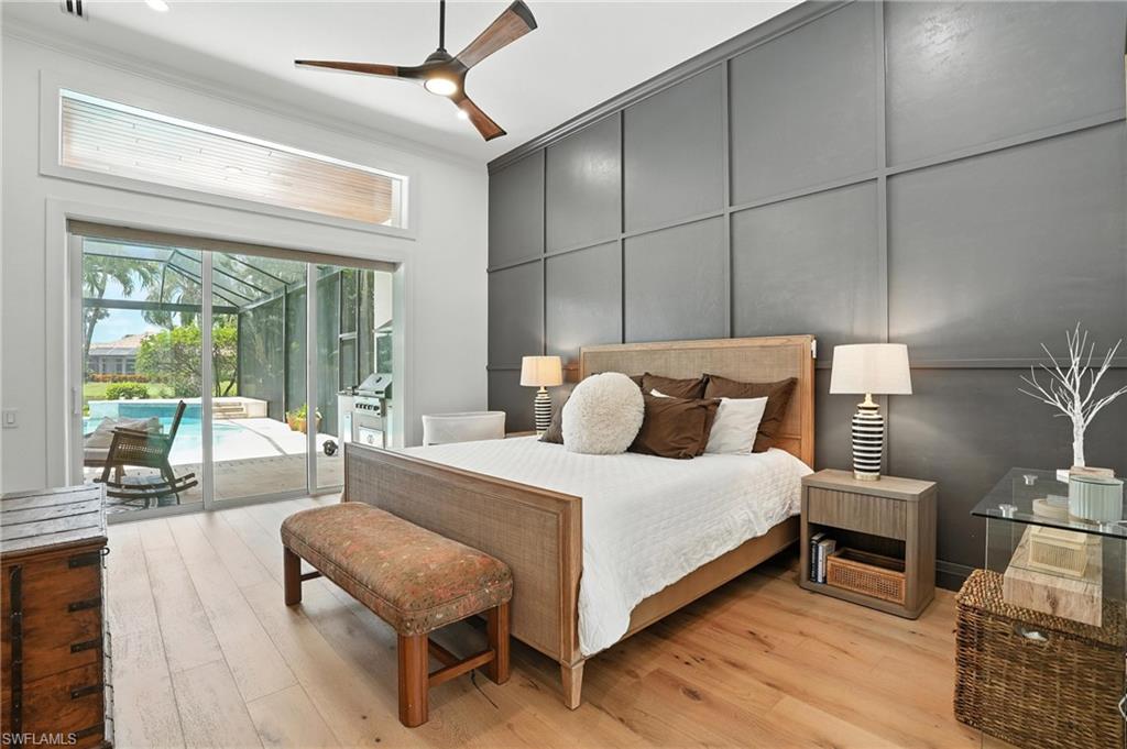 581 Wedgewood Way Naples, FL 34119 - Photo 13 of 33 a bedroom with a bed a table and chair