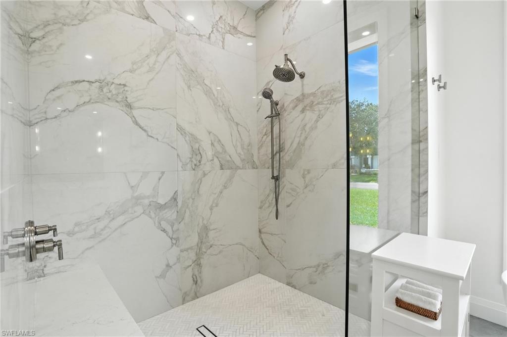 581 Wedgewood Way Naples, FL 34119 - Photo 15 of 33 a bathroom with a shower and a sink