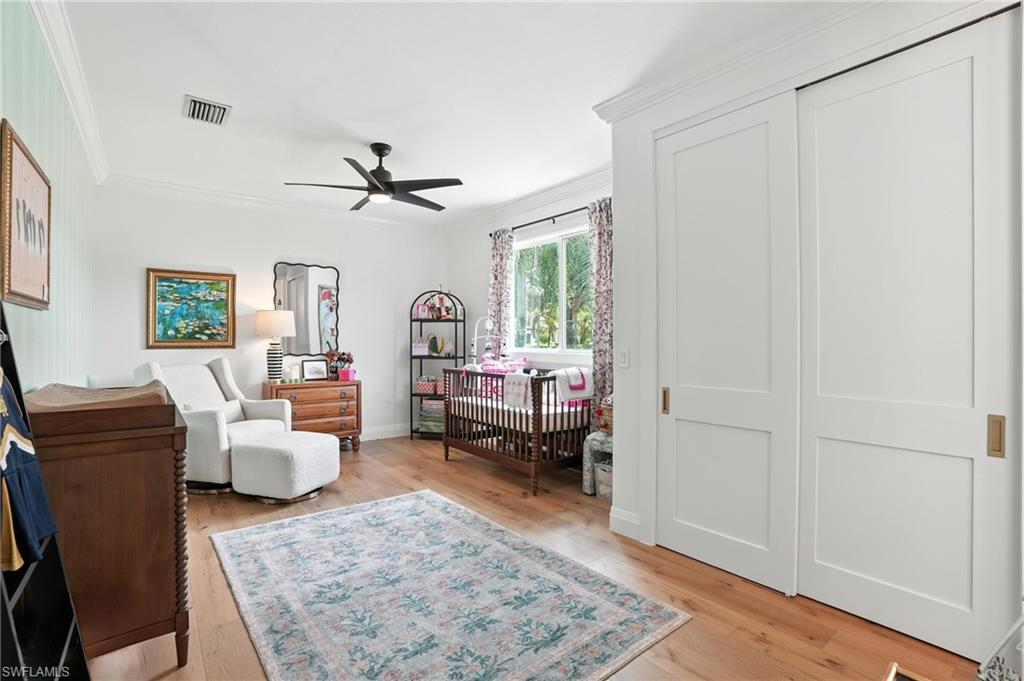581 Wedgewood Way Naples, FL 34119 - Photo 18 of 33 a living room with furniture and a rug