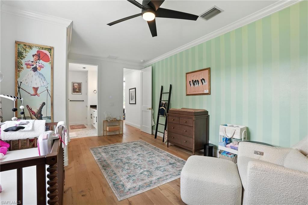 581 Wedgewood Way Naples, FL 34119 - Photo 19 of 33 a living room with furniture and a wooden floor