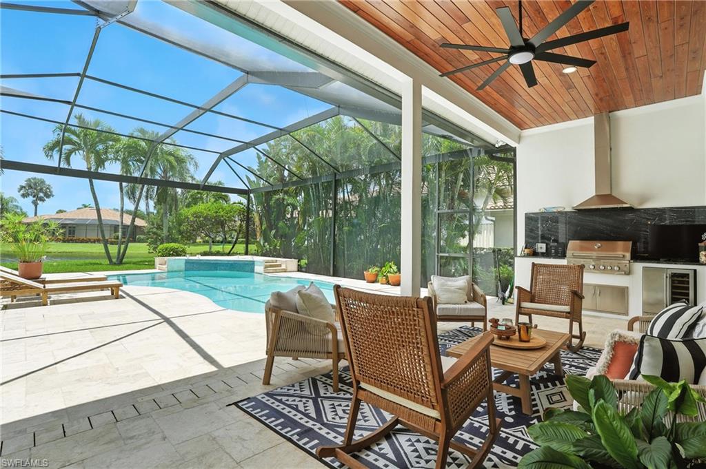 581 Wedgewood Way Naples, FL 34119 - Photo 24 of 33 a building outdoor space with patio furniture and garden view