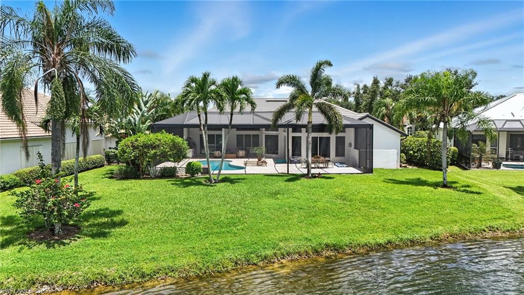 581 Wedgewood Way Naples, FL 34119 - Photo 30 of 33 a front view of a house with garden