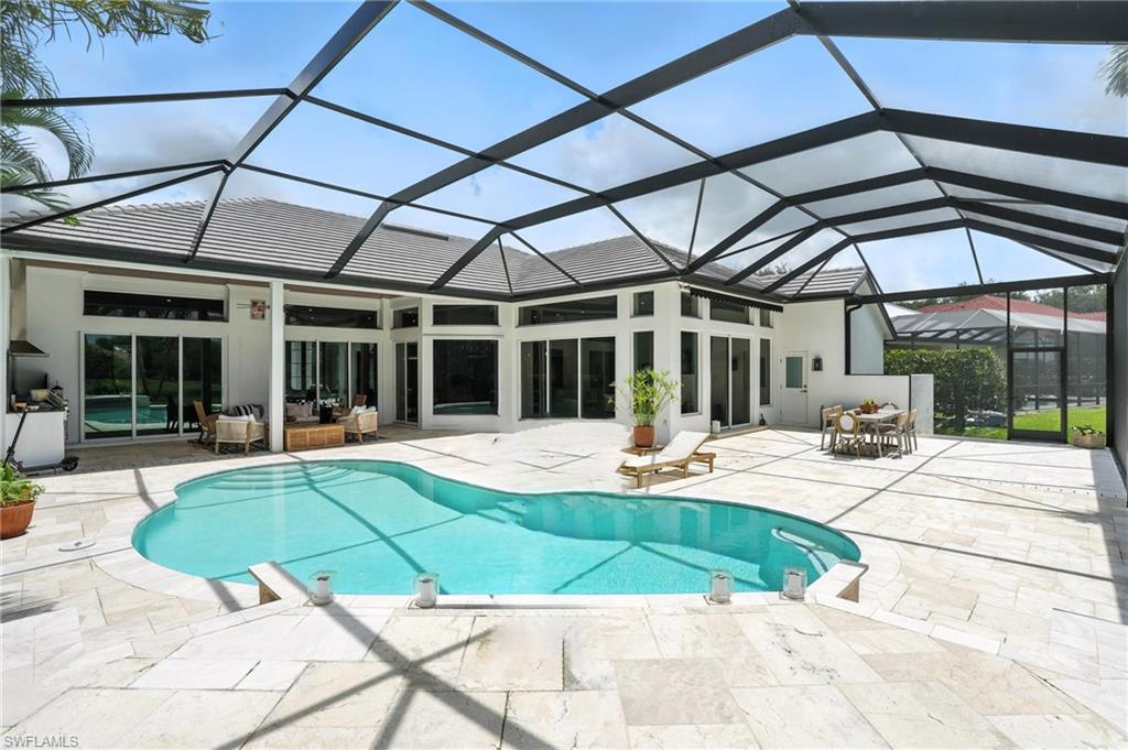581 Wedgewood Way Naples, FL 34119 - Photo 3 of 33 a view of a house with sitting area and a yard