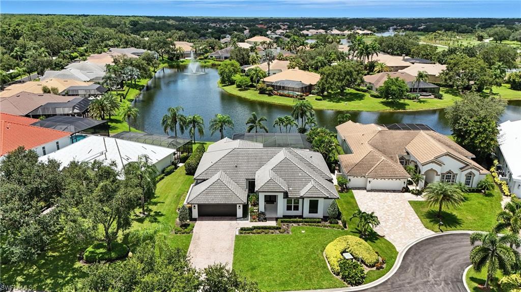 581 Wedgewood Way Naples, FL 34119 - Photo 31 of 33 an aerial view of a house with a yard basket ball court and outdoor seating