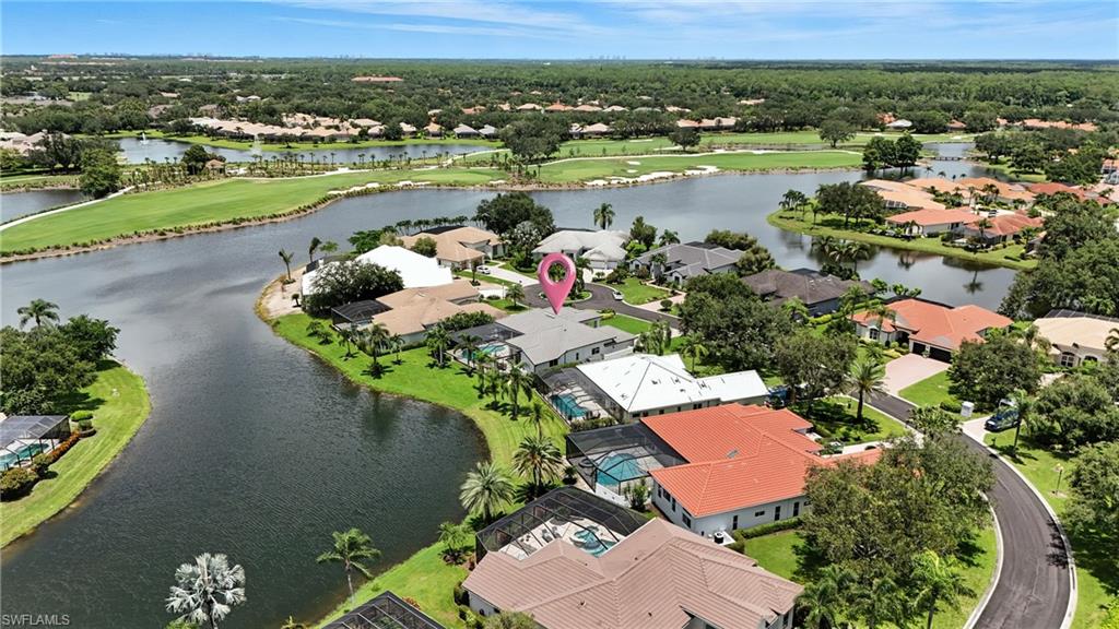 581 Wedgewood Way Naples, FL 34119 - Photo 32 of 33 an aerial view of lake residential house with outdoor space