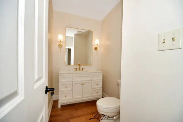 a view of a kitchen with wooden floor