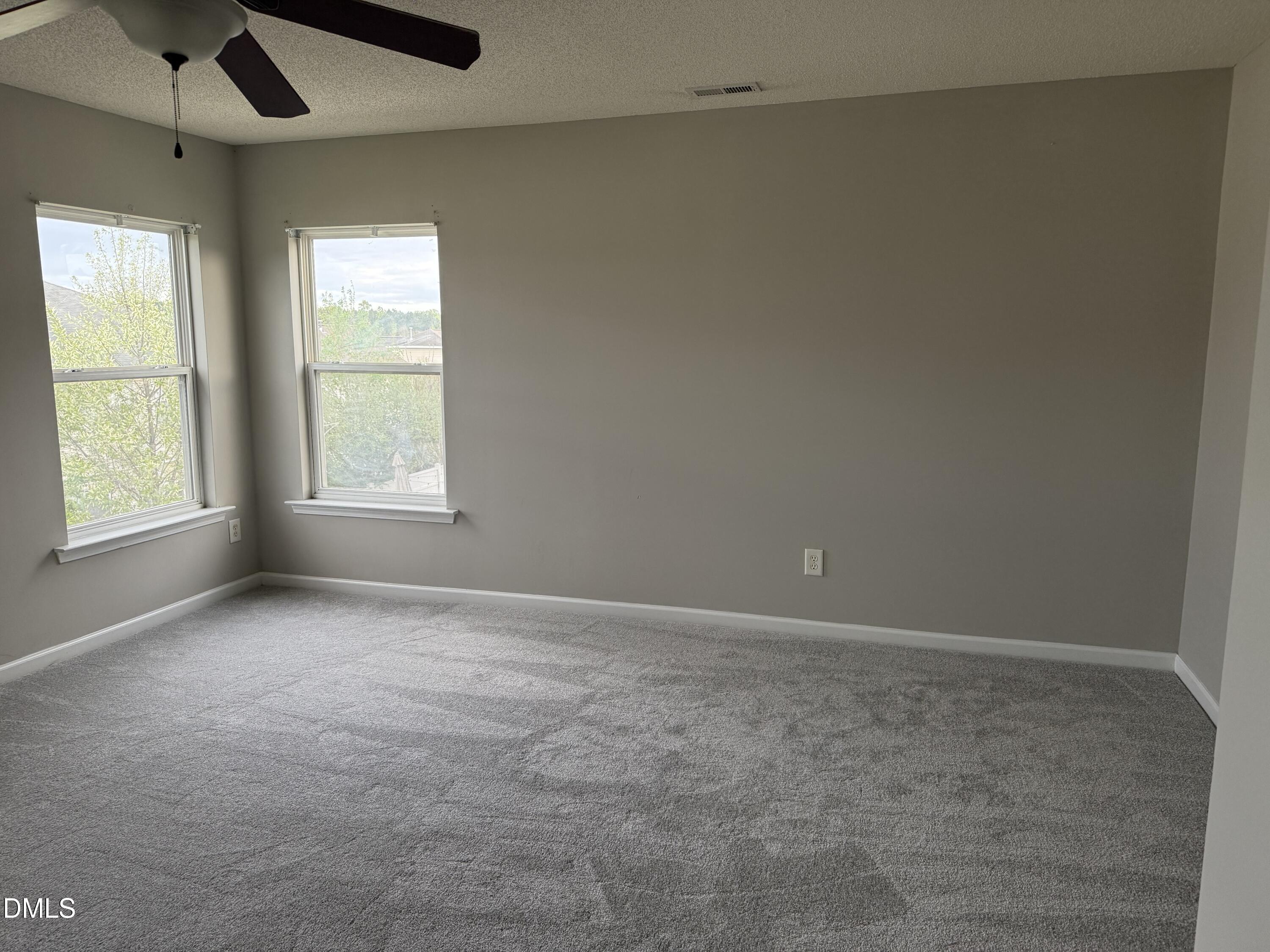3133 Mackinac Island Lane Raleigh, NC 27610 - Photo 11 of 19 an empty room with windows