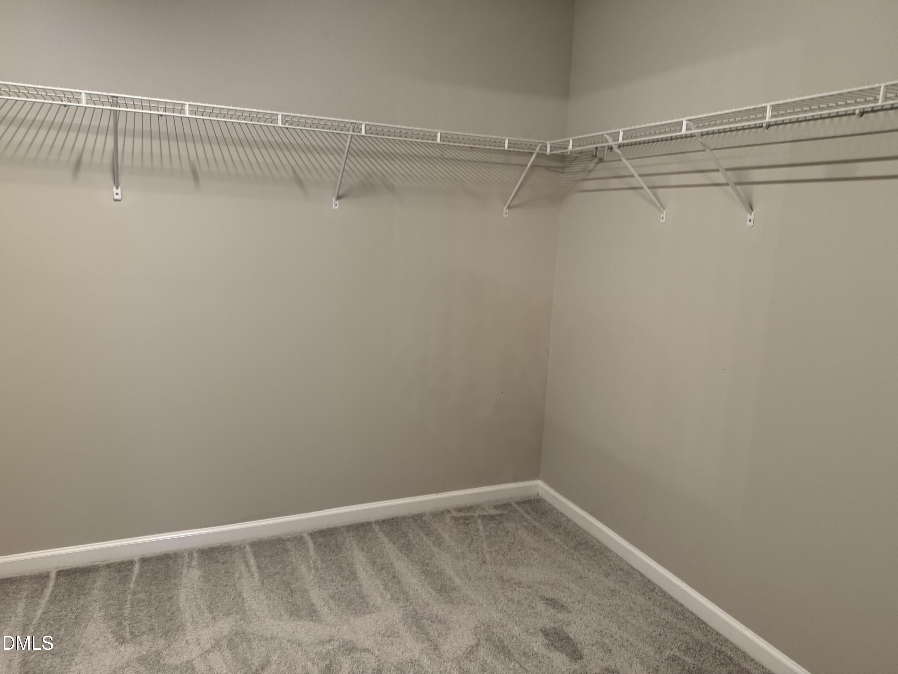 3133 Mackinac Island Lane Raleigh, NC 27610 - Photo 15 of 19 a view of an empty walk in closet
