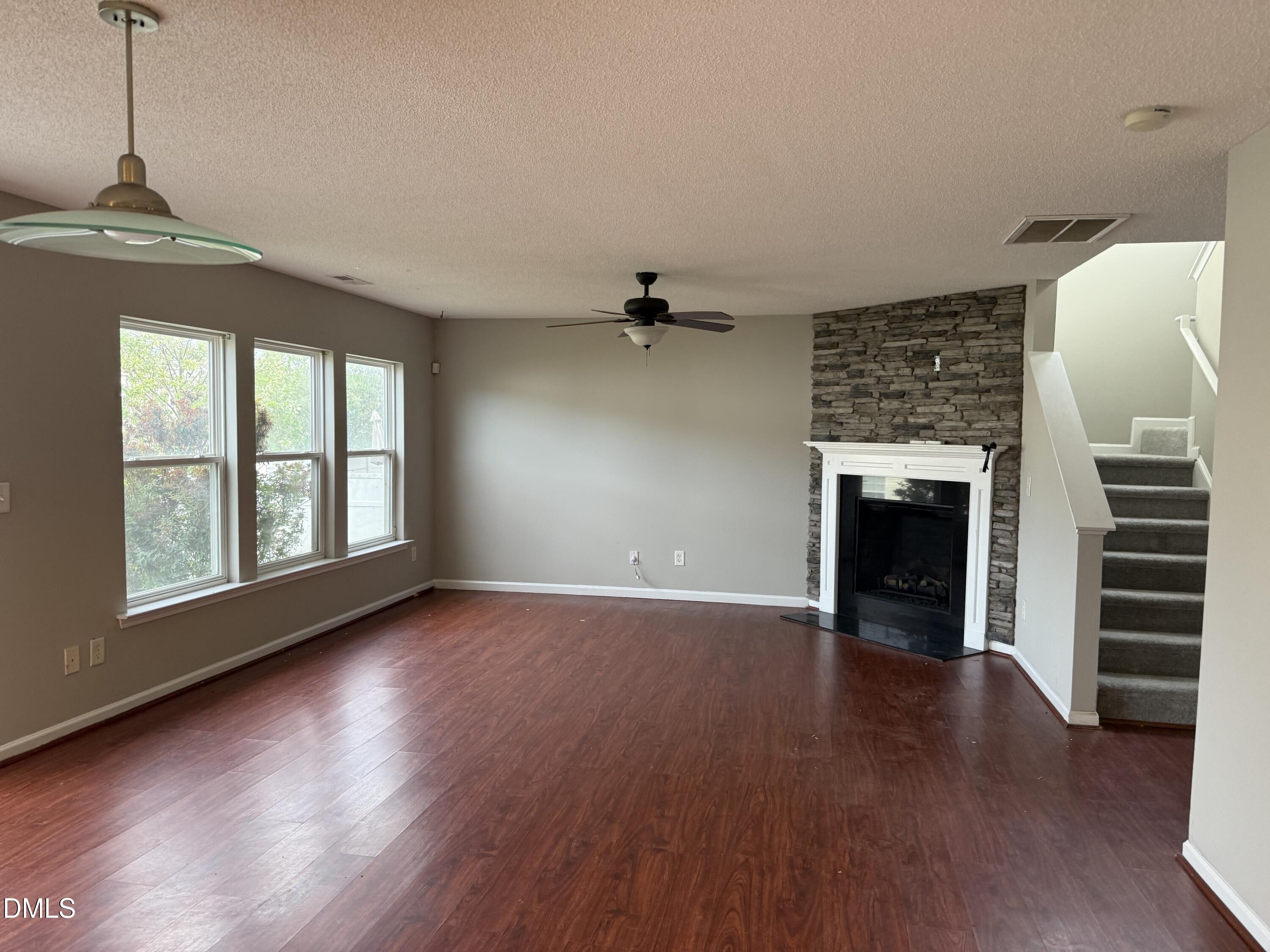3133 Mackinac Island Lane Raleigh, NC 27610 - Photo 10 of 19 wooden floor in an empty room with a window