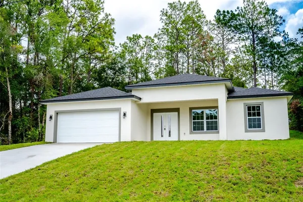 front view of a house with a big yard