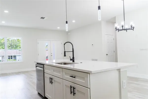 a kitchen with a sink and a window