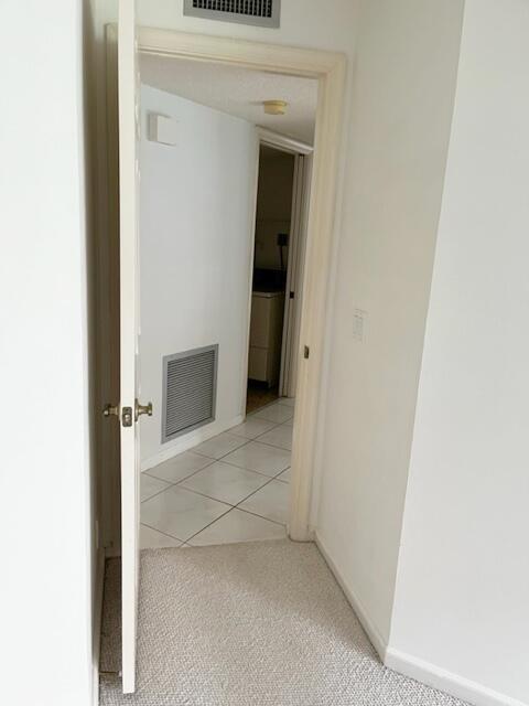 5520 Coach House Circle, Unit A Boca Raton, FL 33486 - Photo 81 of 101 Mstr hall to laundry