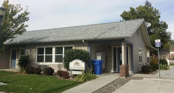 a view of a house with a garden and plants