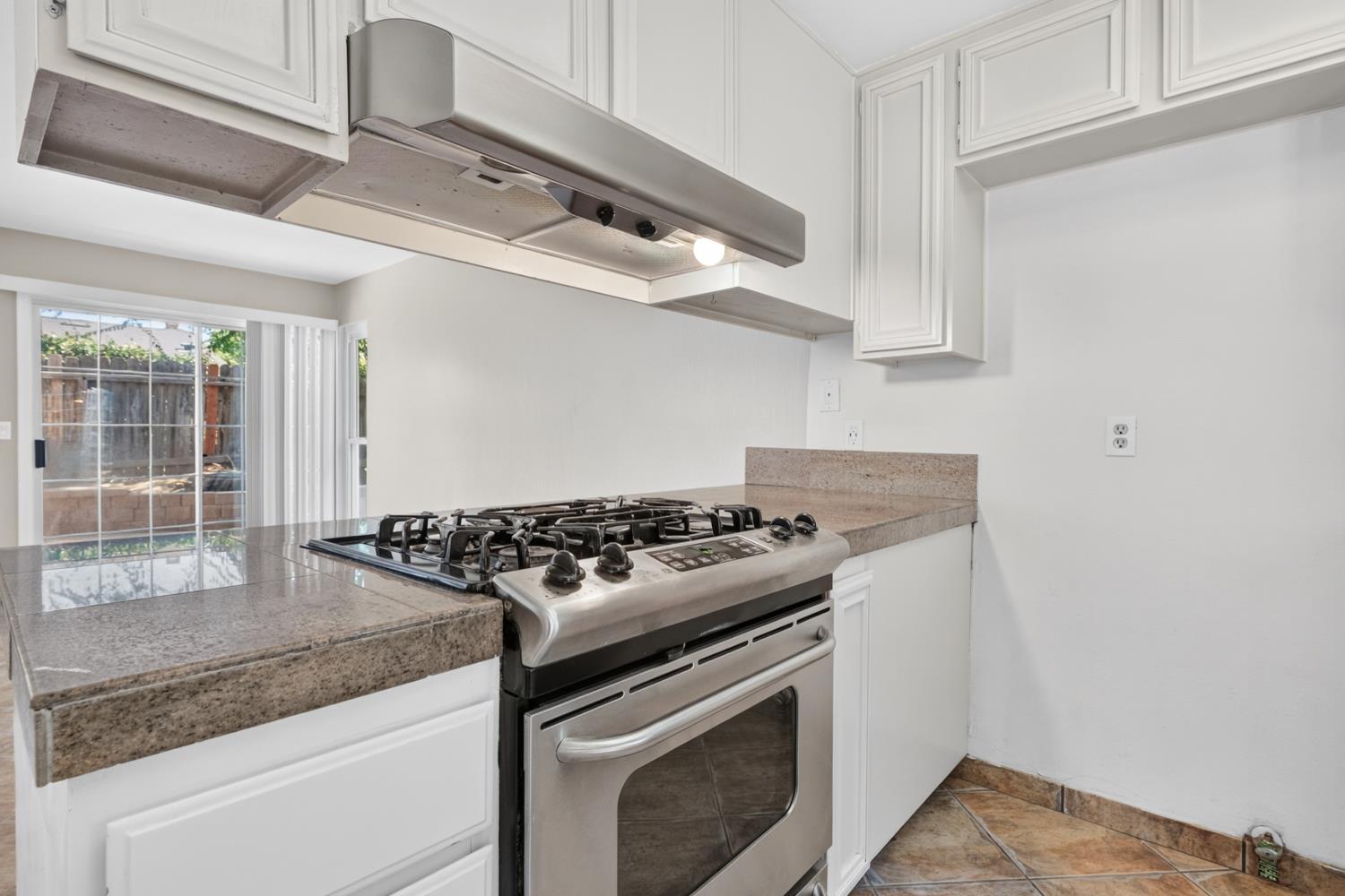 8488 Old Ranch Road Orangevale, CA 95662 - Photo 16 of 51 a white stove top oven sitting inside of a kitchen
