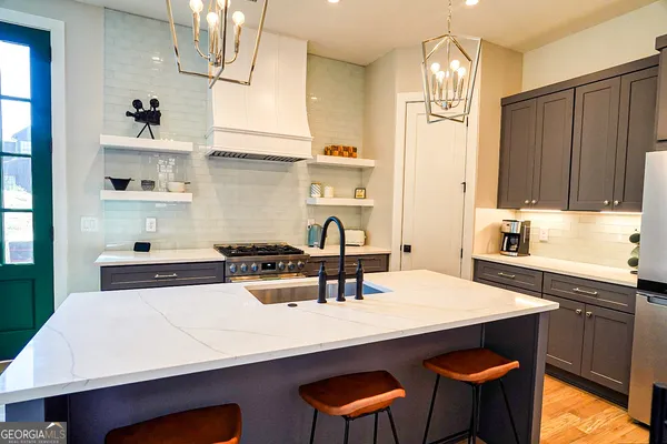 a kitchen with a dining table and chairs