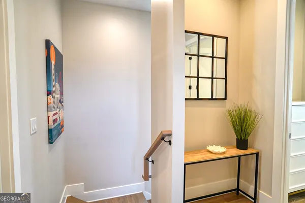 a workspace room with furniture and window