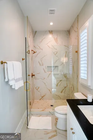 a bedroom with a bed and a microwave