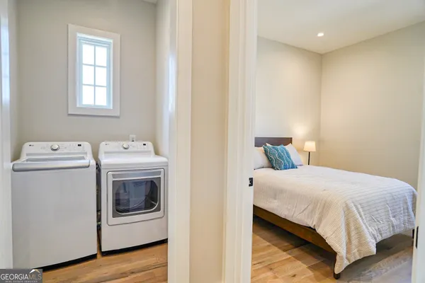 a bedroom with a bed and a night stand