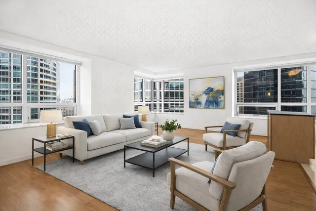 a living room with furniture and a large window