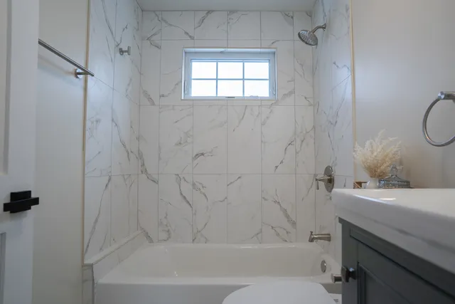 a bathroom with a sink a toilet and a bathtub