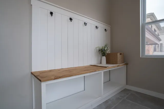 a room with a table and potted plant