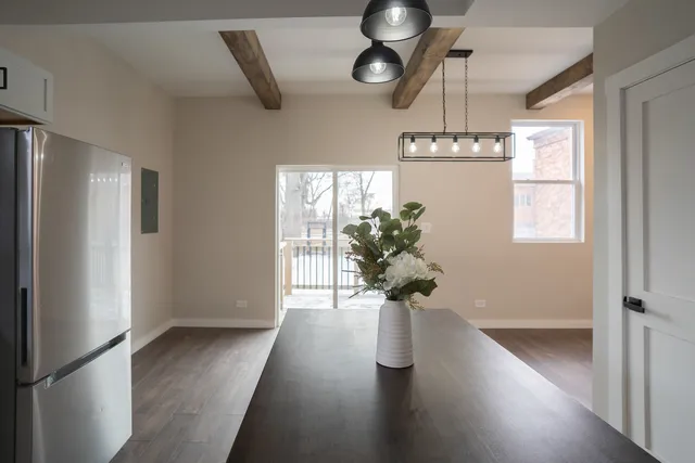 a view of hall way with furniture and a window