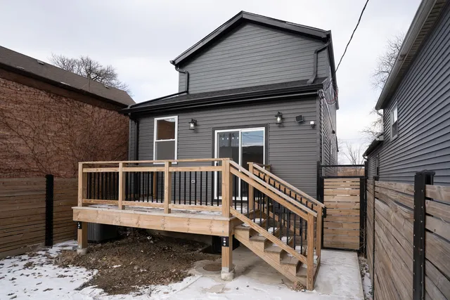 a front view of a house with a deck