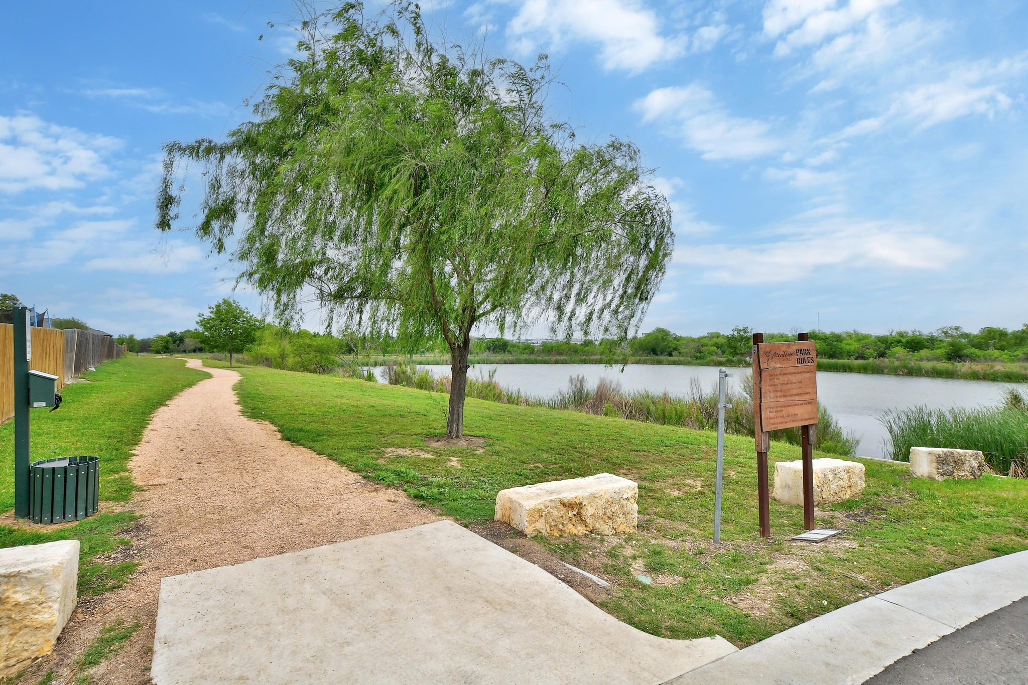 877 Hot Spring Valley Buda, TX 78610 - Photo 34 of 36 a garden view with a lake view
