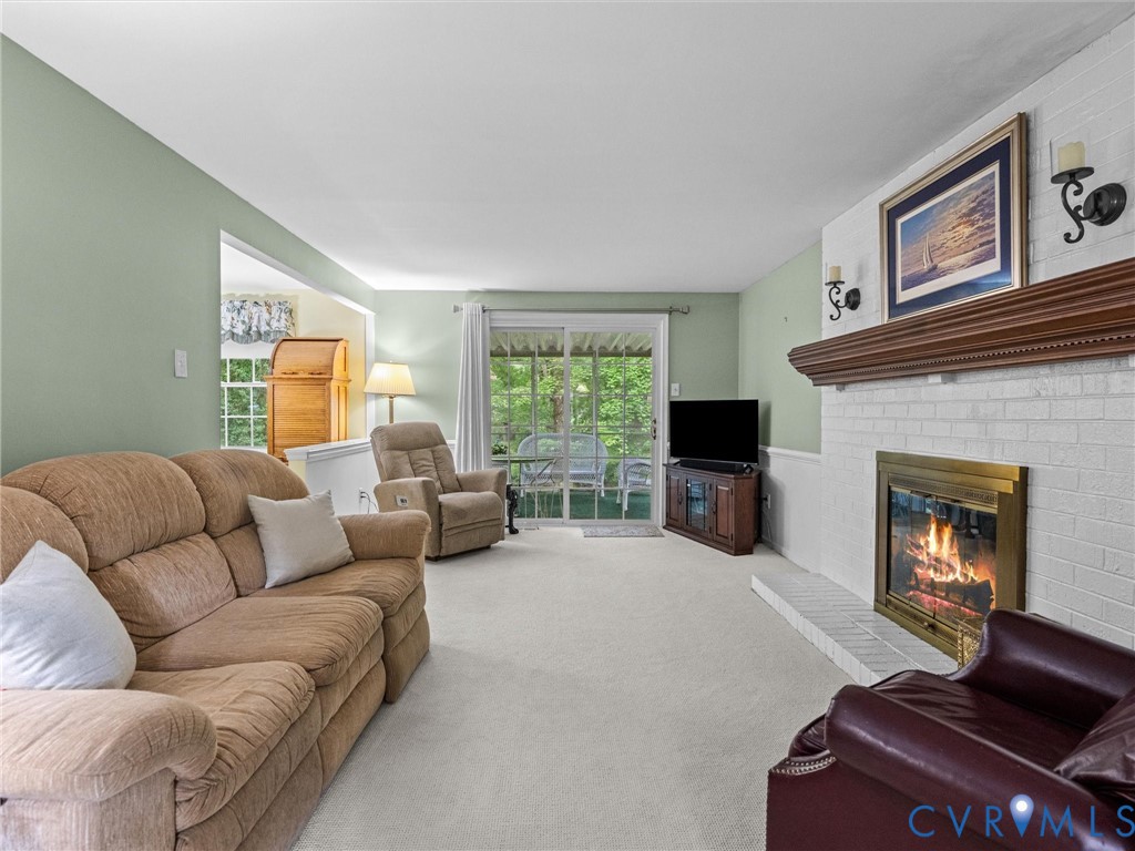 112 Chasnell Road North Chesterfield, VA 23236 - Photo 31 of 49 Painted brick fireplace with a decorative wood man