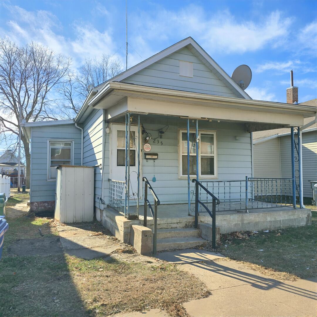 235 4th Avenue North Clinton, IA 52732 - Photo 2 of 11 a front view of a house with garden