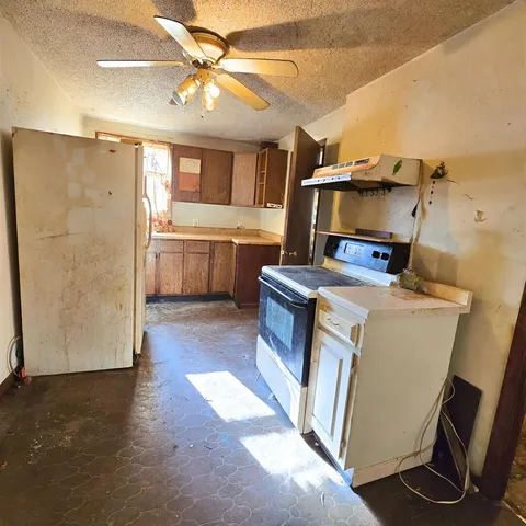 a utility room with faucet washer and dryer