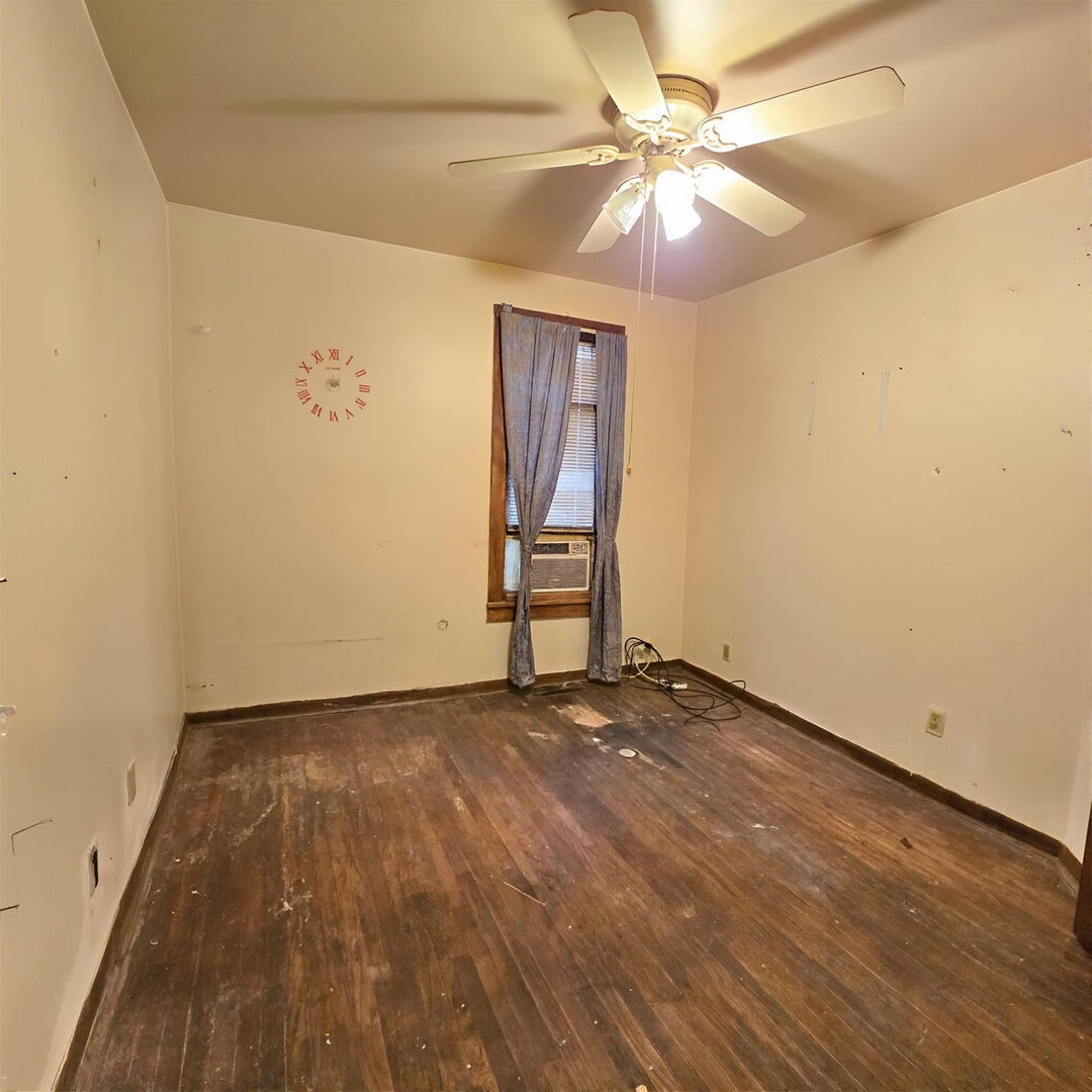 235 4th Avenue North Clinton, IA 52732 - Photo 10 of 11 wooden floor in a hall with a window