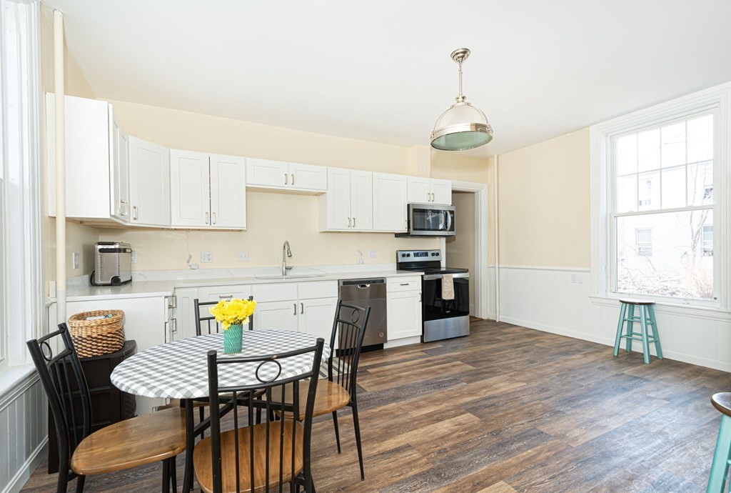 56 William Street Worcester, MA 01609 - Photo 11 of 37 a view of a dining room with furniture and wooden floor