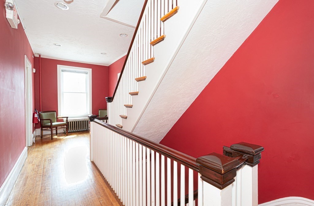 56 William Street Worcester, MA 01609 - Photo 19 of 37 a view of a livingroom with wooden floor and furniture