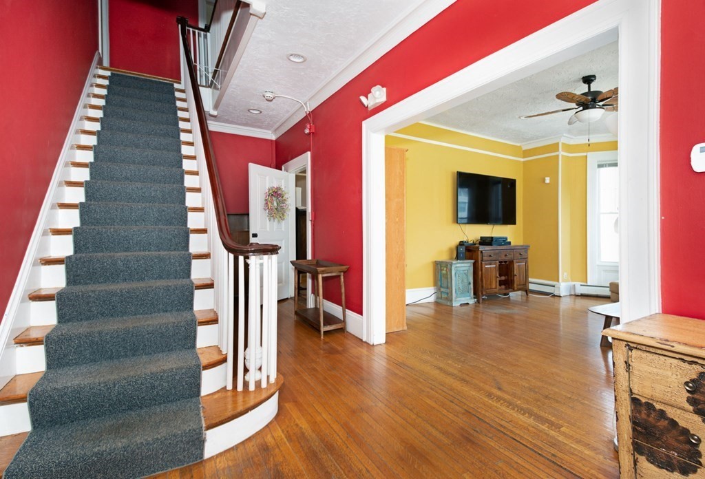 56 William Street Worcester, MA 01609 - Photo 2 of 37 a view of entryway and hall with wooden floor