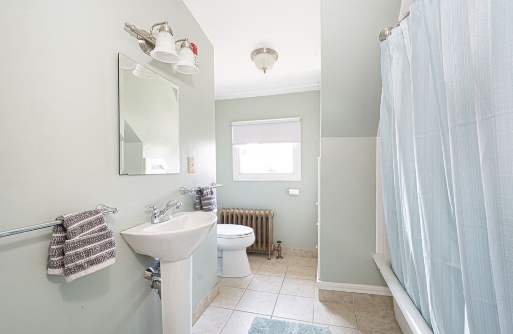 56 William Street Worcester, MA 01609 - Photo 26 of 37 a bathroom with a sink toilet and a mirror