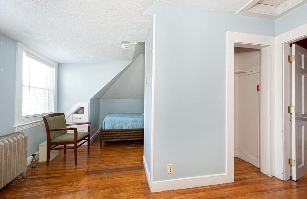 56 William Street Worcester, MA 01609 - Photo 29 of 37 a view of a livingroom with furniture and hardwood floor