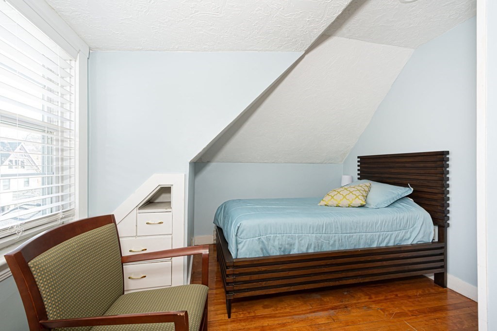 56 William Street Worcester, MA 01609 - Photo 30 of 37 a bedroom with furniture and a window