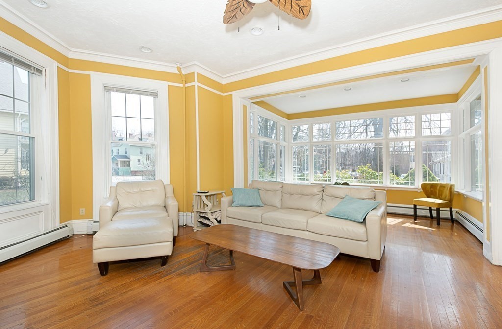 56 William Street Worcester, MA 01609 - Photo 4 of 37 a living room with furniture and a large window