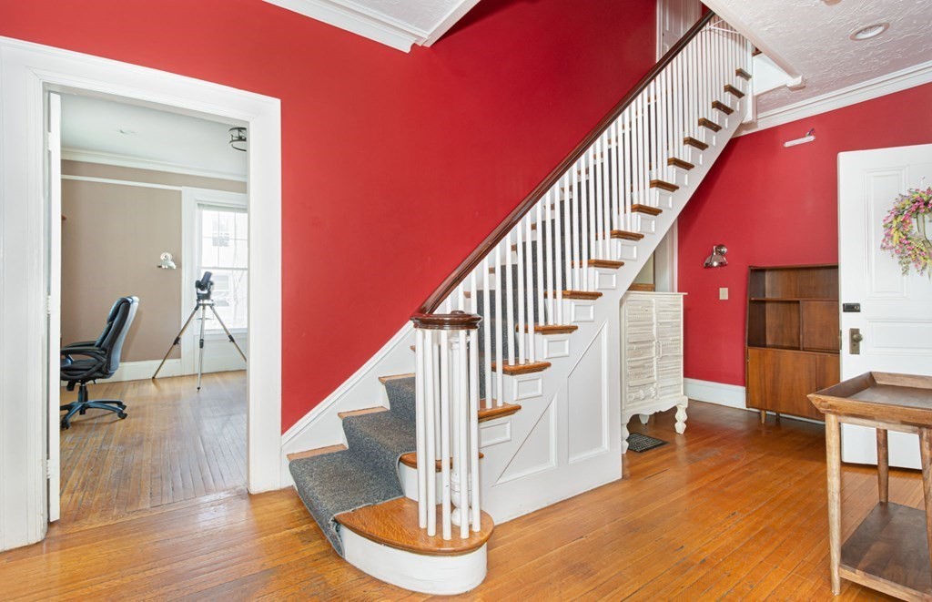 56 William Street Worcester, MA 01609 - Photo 6 of 37 a view of entryway and hall with wooden floor
