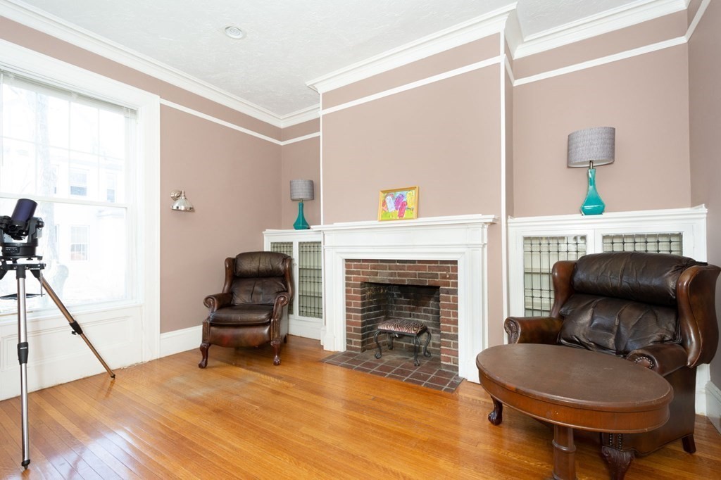 56 William Street Worcester, MA 01609 - Photo 8 of 37 a living room with furniture and a fireplace